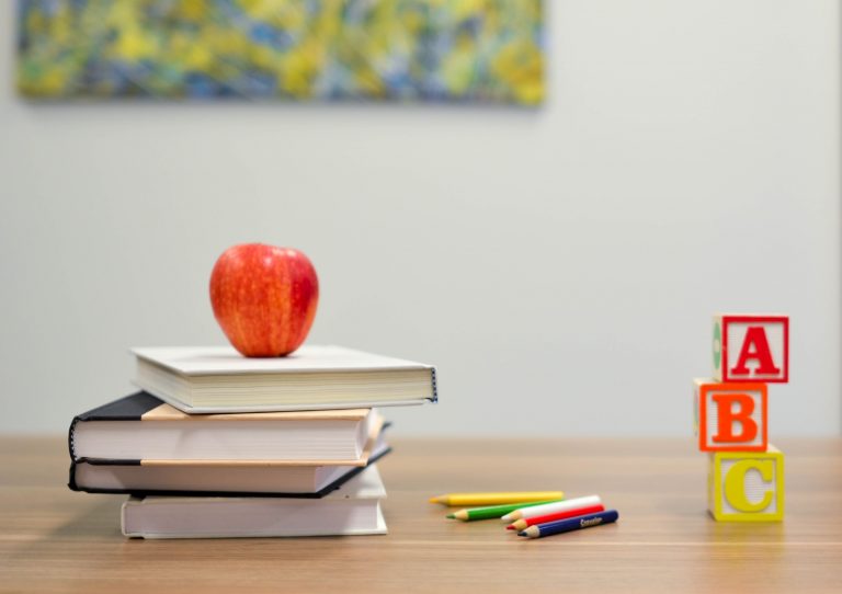 picture of school books and other things on a desk